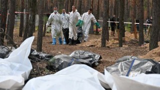 Kremlin dismisses mass burial discoveries as 'lies'