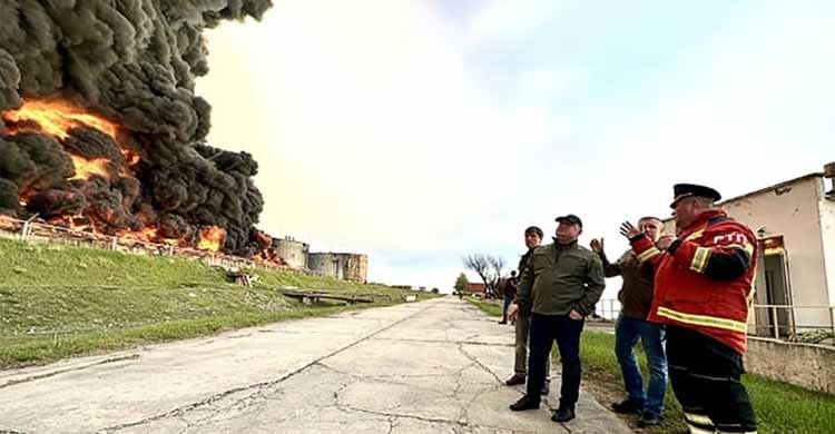 Crimea fuel depot on fire, Russian-held towns shelled in Ukraine